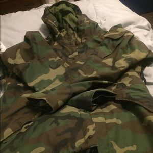 Army fatigue jacket & white pair of vans